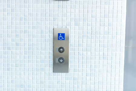 Interior of a modern closeup of the elevator button .