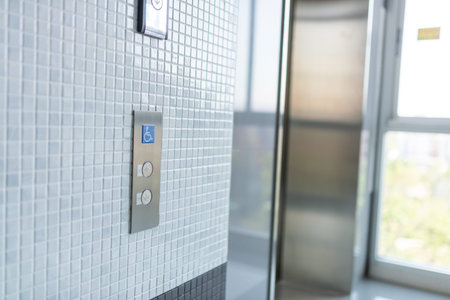 Interior of a modern closeup of the elevator button .