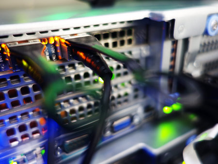 close-up of network cables connected to servers in data center room
