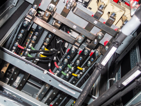 Detailed view of complex wiring and connections within an electrical panel system. Highlighting the organization of cables and circuitry for optimal power distribution.の写真素材