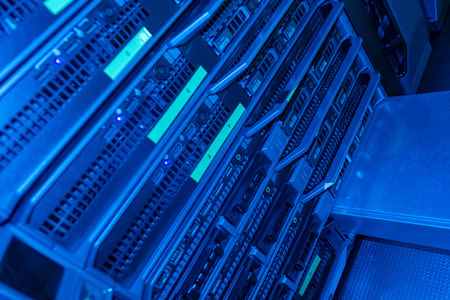 Close-up view of multiple rack-mounted servers illuminated by blue light, showcasing technology...