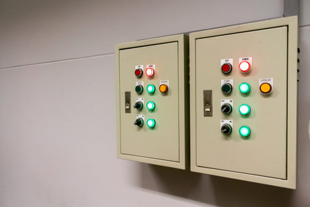 Control panels featuring various buttons and indicators, showcasing the technology used in...
