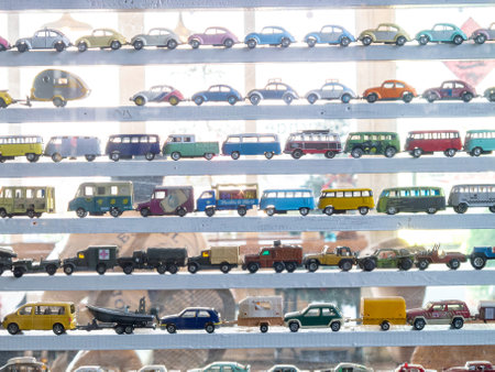 This image captures a vibrant display of vintage toy cars, highlighting a diverse collection. Perfect for themes of nostalgia and unique design.の写真素材