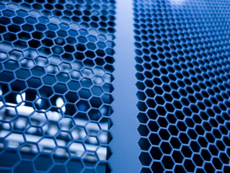 This image showcases a close-up view of a modern hexagonal metal mesh with a striking blue hue,...