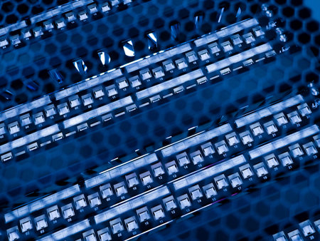 Close-up view of a blue circuit board featuring a hexagonal pattern overlay. The image highlights...