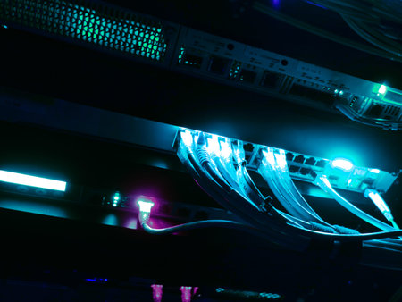 Vibrant network cables illuminate a server environment, showcasing modern technology and data...