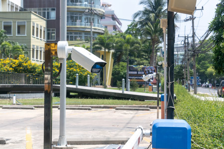 A modern surveillance camera captures the urban street environment. This image showcases security...