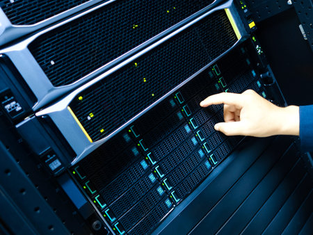 A technician performs maintenance on a server panel, showcasing modern technology and the importance...