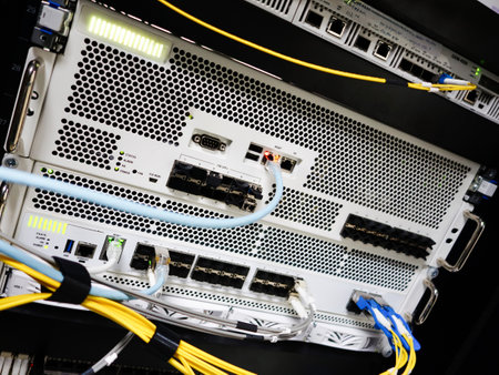 Close-up view of network equipment in a data center, showcasing servers and cables. Ideal for technology, IT, and infrastructure content.の写真素材