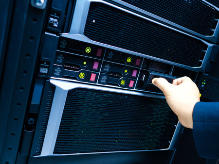 A technician manages a server in a data center, showcasing the importance of maintenance and operation in modern information technology environments.の写真素材