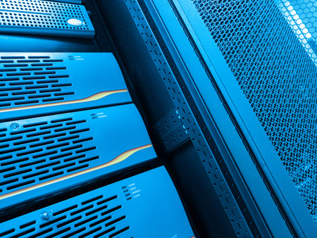 This image shows a close-up view of a blue server rack in a modern data center. The design...
