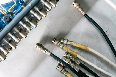 A detailed close-up view of electronic connectors and coaxial cables, showcasing the intricate design and functionality in technology and communications.の写真素材