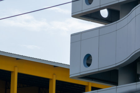 A striking modern architecture featuring curved lines and bright colors, showcasing contemporary design elements and innovative construction aesthetics.の写真素材