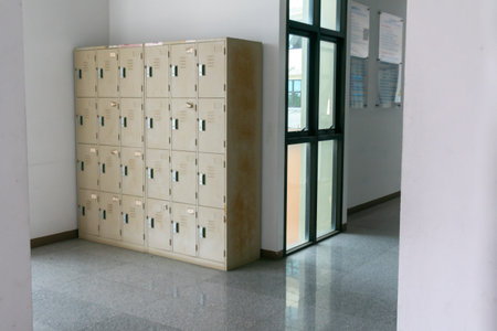 A spacious corridor featuring a row of lockers providing secure storage solutions. The interior...