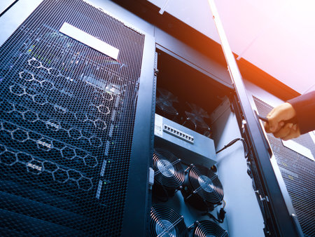 A detailed view of a server rack featuring cooling fans and network equipment, highlighting the intricate technology used for data management and server operations.の写真素材