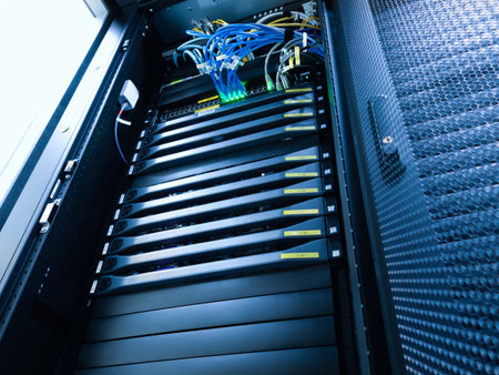A high-tech server rack showcases advanced network equipment with organized cables, reflecting modern technology in data management and storage solutions.の写真素材