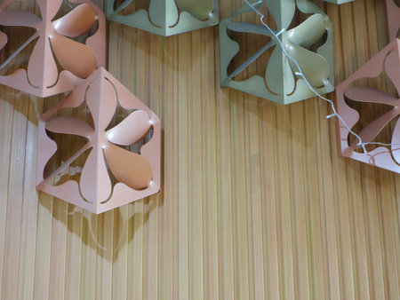 A captivating display of decorative wall art featuring geometric patterns and a mix of warm colors, perfect for enhancing modern interior spaces and adding character.の写真素材