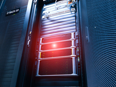 A detailed view of a server rack setup in a modern data center, showcasing organized IT equipment, efficient cooling systems, and essential network connections.の写真素材
