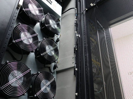 A close-up view of cooling fans inside a server rack system, showcasing the importance of airflow...