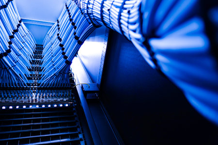 A visually striking image showcasing blue fiber optic cables neatly arranged in a high-tech network...