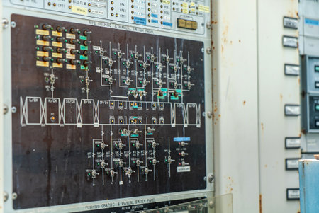 Detailed image of a control panel featuring various switches and wiring diagrams. This industrial equipment is essential for monitoring and operating machinery functions.の写真素材