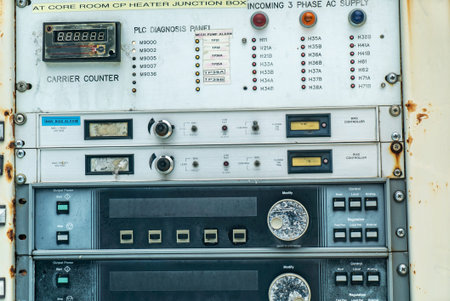 Detailed control panel with buttons and digital display. This image captures industrial technology and equipment used for monitoring and diagnostics.の写真素材