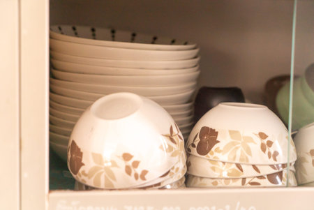 A beautifully arranged collection of elegant dishware featuring floral patterns. Perfect for...