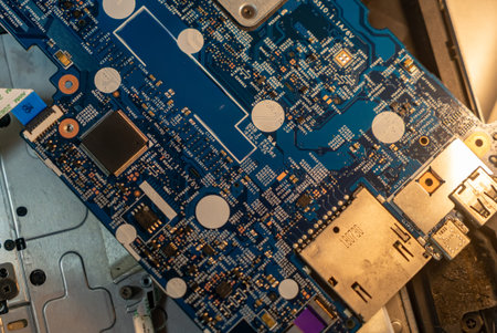 A detailed close-up view of a computer circuit board showcasing intricate components, connections,...