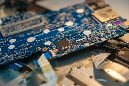 A detailed close-up view of a blue circuit board showcasing various electronic components, highlighting the intricate design and technology behind modern devices.の写真素材