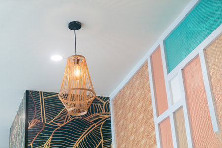 Beautiful pendant light fixture illuminating a modern indoor space. The stylish design adds an artistic touch to any contemporary interior.の写真素材