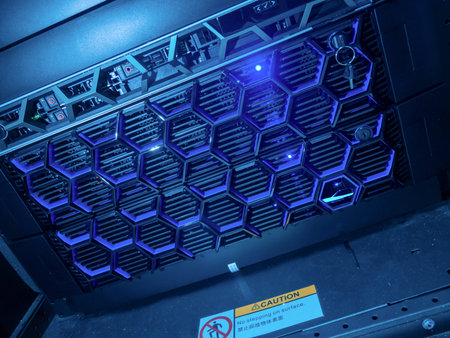 A close-up view of a futuristic rack server featuring blue LED lights and a caution sign, showcasing...