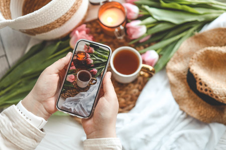 The girl takes a photo on her phone, the aesthetics of summer.