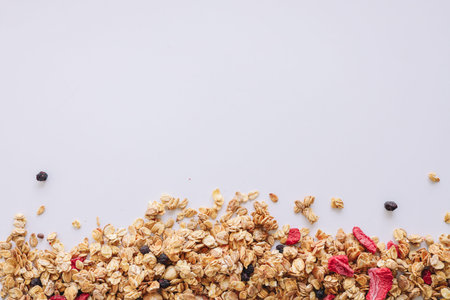 Granola close-up on a white background, space for text.の写真素材