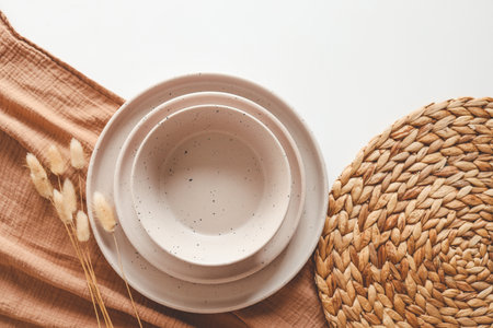 Set of stylish beige tableware set flat lay top view on white background.の写真素材