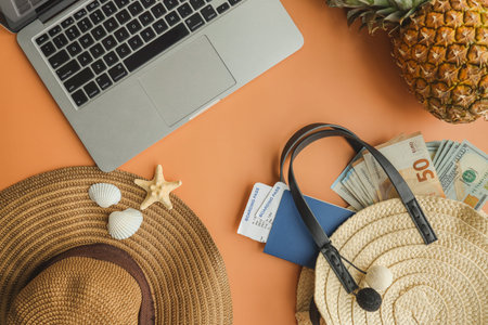 Flat lay summer concept composition, beach bag with money, passport and tickets.