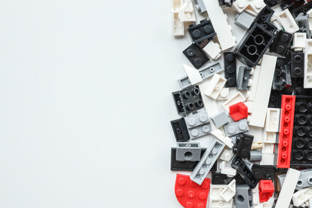 Wall from Plastic building blocks isolated on white background. Top view with space