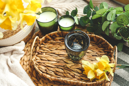 morning aesthetic route. water glass, bouquet and candles.の写真素材