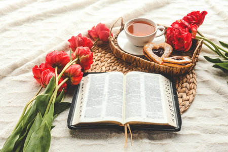 Open bible in home morning interior.