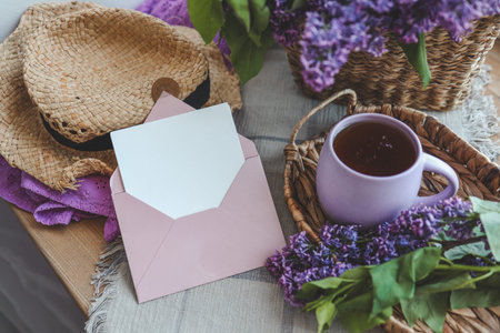 Envelope with letter and gift box in spring decor.
