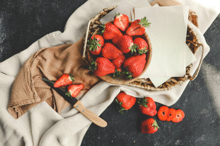 Strawberries in wooden bowl. Fresh nice strawberries on wooden table. Good morning and breakfast...