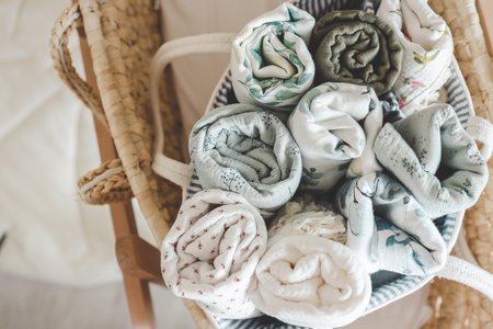 Basket with baby muslin diapers for a newborn.