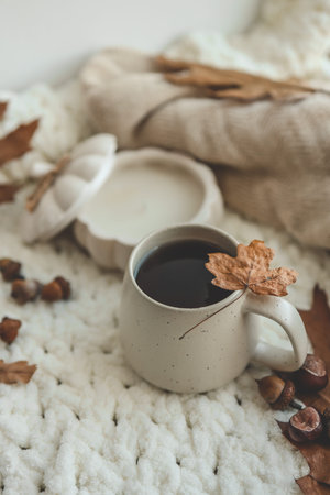 Cup of hot tea and a leaf, autumn mood.