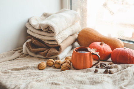 Cup of hot tea and a leaf, autumn mood.
