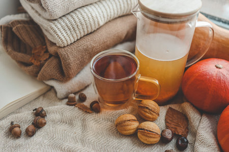 Cup of hot tea and a leaf, autumn mood.