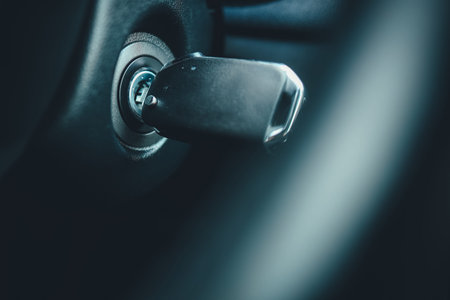 Ignition key of modern car close up. Car key in keyhole.