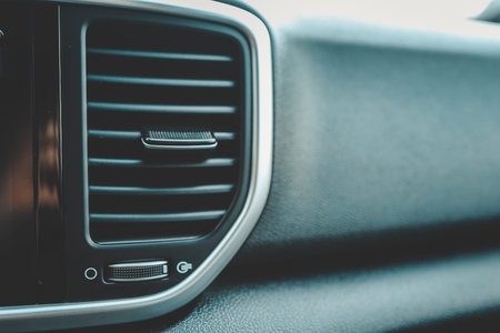 Modern car climate control panel for driver and passenger with shallow depth of field. Zone climate...