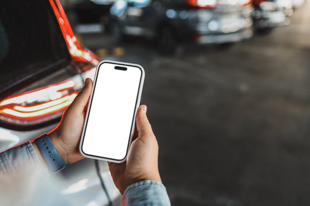 Phone with isolated screen on the background of a car.