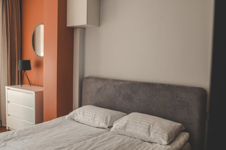 Stylish fashionable bedroom interior, bed.