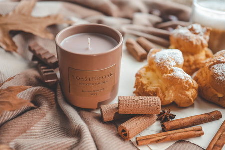 Candle and sweet cookies, aesthetic photo.