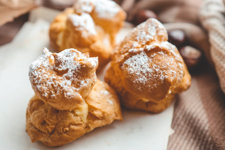 Freshly baked choux pastries close up.